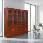 The 5-Door Mahogany Storage Cabinet provides a spacious and practical storage solution for offices, executive rooms, institutions, businesses, and professional workspaces. Its five-door design gives you ample room to organize files, documents, books, stationery, office equipment, and other essential items. Furthermore, its rich mahogany appearance adds a classic and professional touch to modern office interiors. Spacious Office Storage This 5-door mahogany storage cabinet provides multiple storage sections for keeping workplace items neatly arranged. You can organize files, folders, books, stationery, supplies, and equipment inside the cabinet while keeping your office free from unnecessary clutter. In addition, the enclosed doors keep stored items neatly out of sight and help create a cleaner working environment. You can place the cabinet alongside executive desks, office workstations, boardroom tables, filing cabinets, and office chairs. Moreover, its generous storage capacity makes it useful for offices that handle large amounts of paperwork and equipment. Elegant Mahogany Design The 5-Door Mahogany Storage Cabinet brings a warm and sophisticated appearance to professional spaces. Its mahogany finish can complement executive desks and other wooden office furniture, creating a coordinated interior. Furthermore, its classic design works well in both traditional and contemporary office settings. The cabinet also helps you make better use of available storage space. As a result, you can keep important office materials organized while maintaining a neat and professional appearance. Ideal for Offices and Institutions This 5-door office storage cabinet suits corporate offices, executive rooms, schools, institutions, business centres, reception areas, and administrative departments. Whether you need storage for files, books, stationery, or general office supplies, it provides a convenient solution for everyday organization. Key Features 5-door mahogany storage cabinet Spacious internal storage Five enclosed storage sections Elegant mahogany appearance Suitable for files and documents Ideal for books and stationery Useful for office supplies Helps reduce workplace clutter Professional executive design Suitable for corporate offices Ideal for institutions and businesses Complements mahogany office furniture Practical everyday storage solution The 5-Door Mahogany Storage Cabinet combines generous storage capacity, classic styling, and practical office organization. Whether used in an executive office, corporate workspace, institution, or business centre, it provides a convenient way to keep documents, books, supplies, and other essentials neatly arranged and easily accessible.
